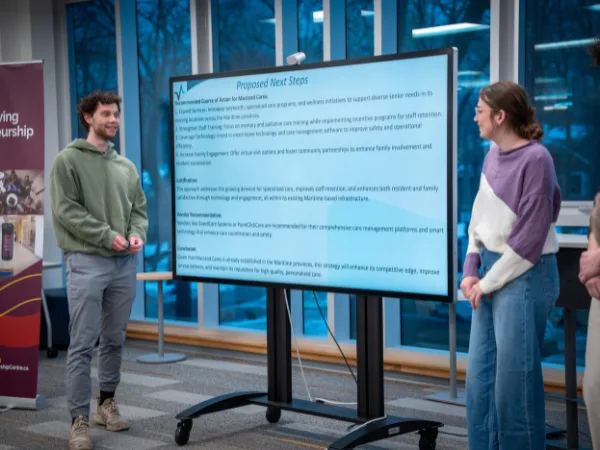 People discussing presentation in office setting.