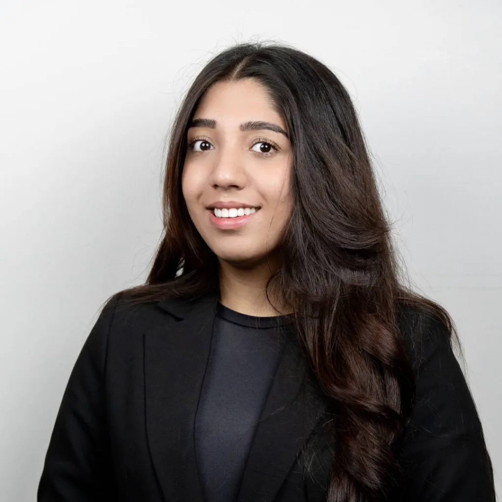 Professional woman in black blazer smiling