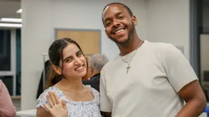 Two people smiling at an event