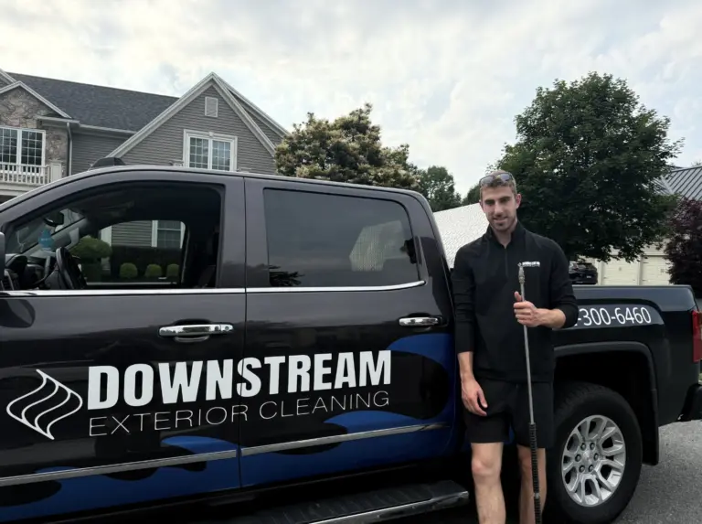 Man standing by Downstream Exterior Cleaning truck.
