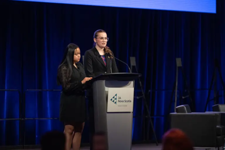 Two women speaking at JA Nova Scotia event.