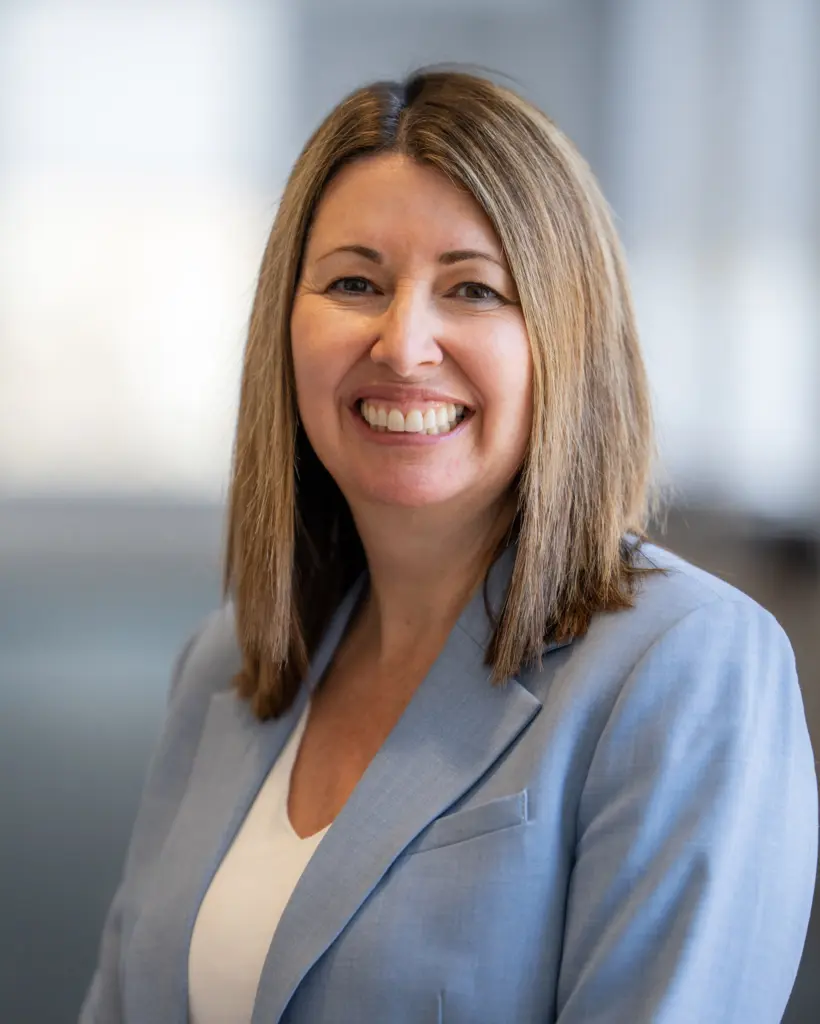 Smiling woman in a blue blazer