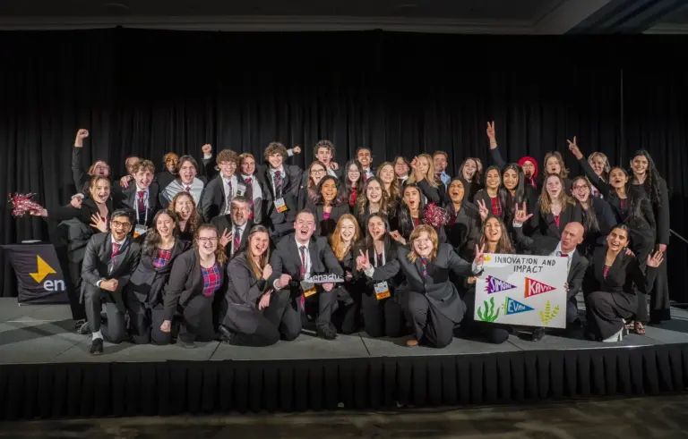Group of students celebrating on stage