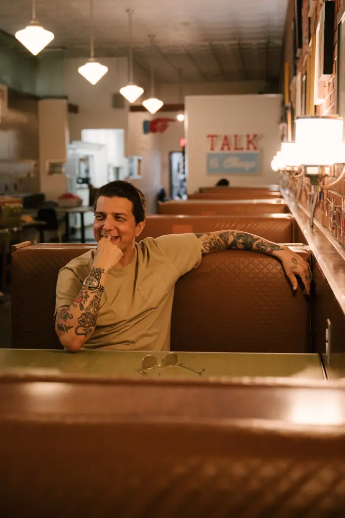 Person relaxing in a cozy diner booth