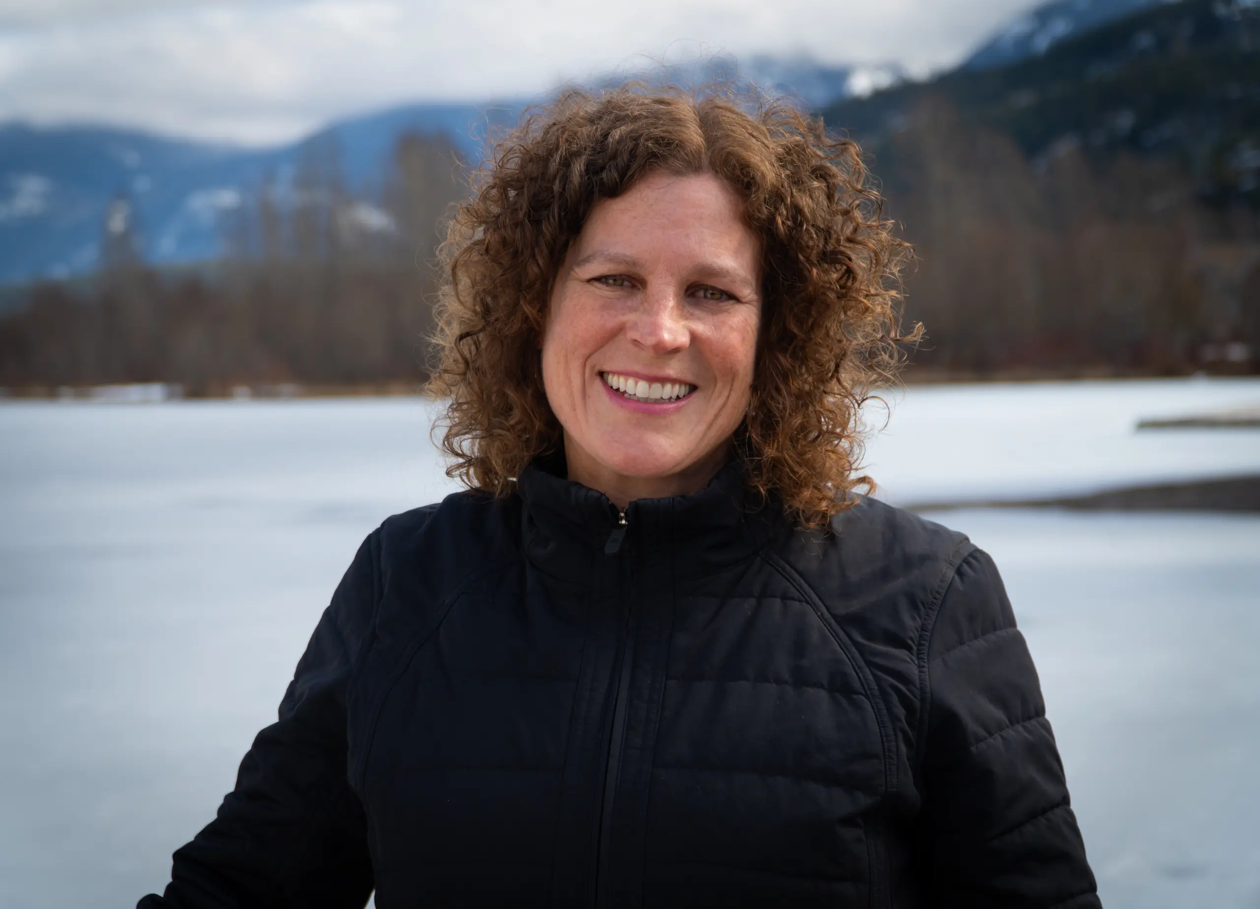 Woman smiling in snowy landscape