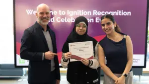 Student receives certificate at recognition event