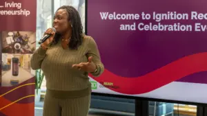 Woman speaking at entrepreneurship celebration event
