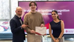 Student receiving certificate at university recognition event