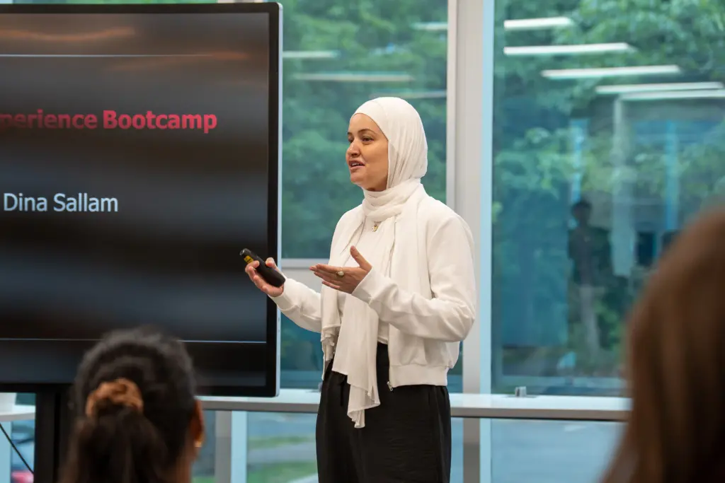 Woman in hijab presenting at Experience Bootcamp
