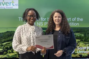 Two women holding certificate at award presentation