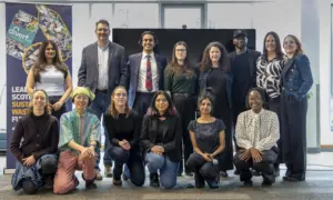 Team posing at sustainability event indoors