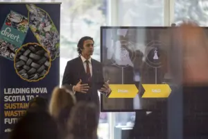 Businessman presenting sustainability initiative to audience