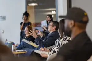 Team meeting discussion in modern office setting