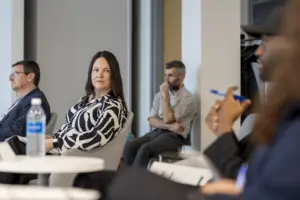 Professionals attending a meeting in a modern office