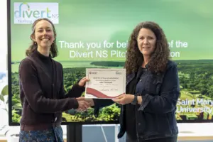 Two women holding certificate at Divert NS event
