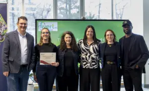 Team posing with certificate at Divert NS event