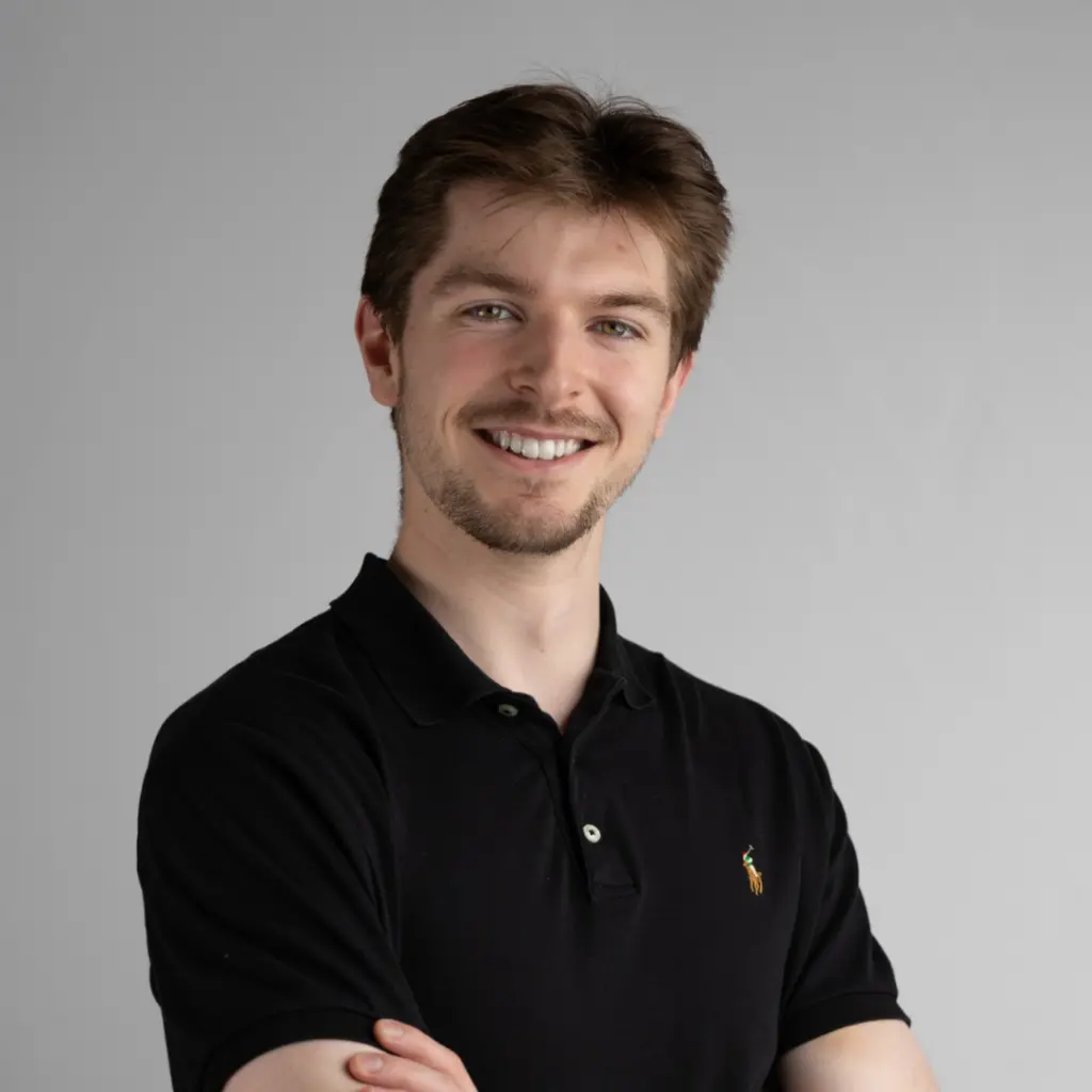Smiling young man in black polo shirt