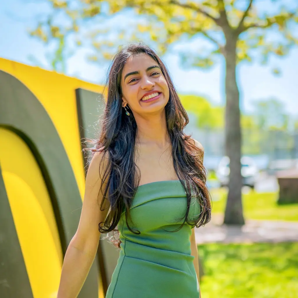 Smiling woman in green dress outdoors