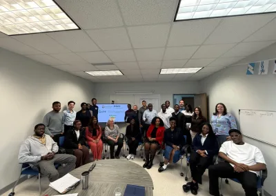 Group of adults posing in classroom meeting room
