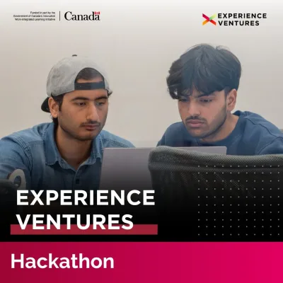 Two participants working at a hackathon event.