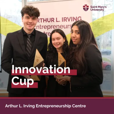 Students at Innovation Cup with trophies.