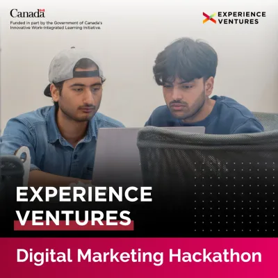Students collaborate on laptop for digital marketing hackathon